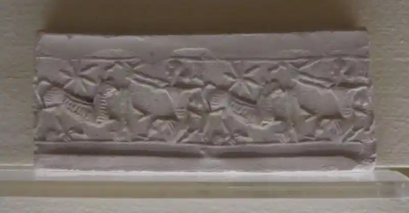 An eight-pointed cross engraved on a rectangular lump of marble stone